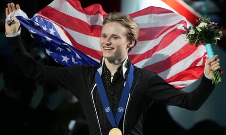 Ilia Malinin, of the United States, celebrates with his gold medal during the Saturday’s victory ceremony.