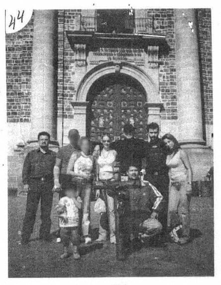 Grainy, black and white shot of a group of friends outside a church.