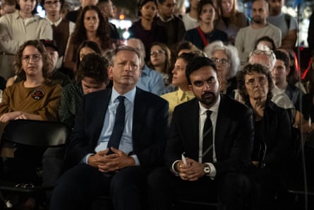 people sit at a vigil