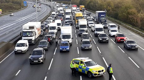 Just Stop Oil activists climb M25 gantries for second day – video report