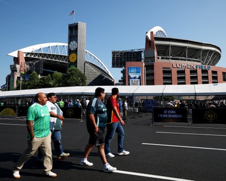 Fans walk outside Lumen Field.