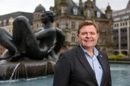 John Cotton standing in front of a fountain