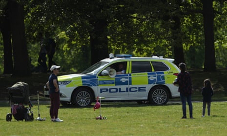 Police patrol in Greenwich Park, London, last weekend, to enforce the lockdown.