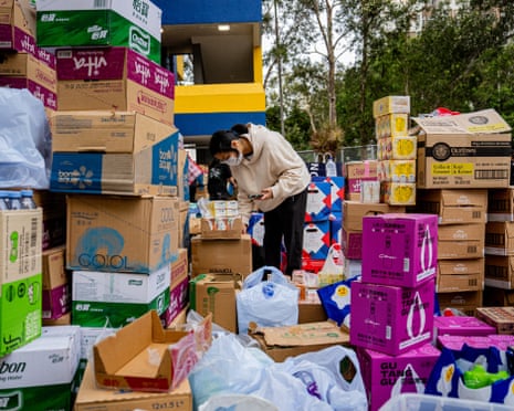 A volunteer sorts relief supplies for people affected by the fire