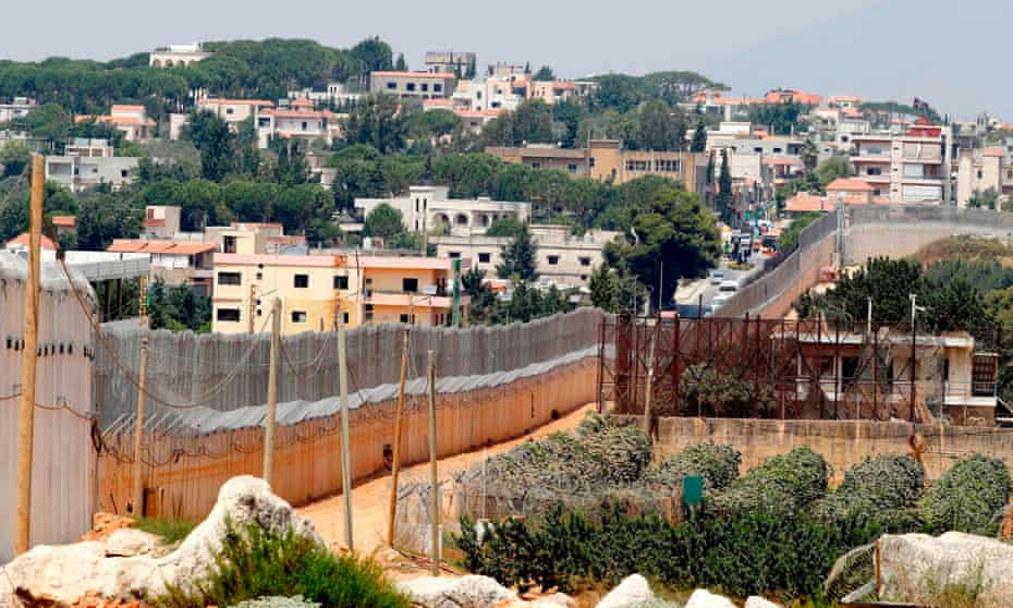 The concrete barrier along Israel’s border with the southern Lebanese village of Kfar Kila