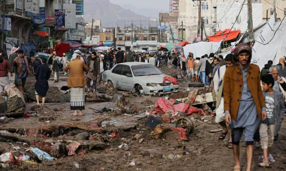 Residents pick their way through a damaged street in the capital Sana’a, Yemen on 14 April 
