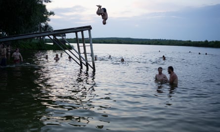Volunteers swimming in a lake at the end of a day’s work.