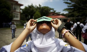 A student at a high school on the Indonesian island of Ternate tests a self-made filter after a joint workshop between the Hong Kong Astronomical Society and Indonesia’s National Institute of Aeronautics and Space at a high school in Ternate island, Indonesia, ahead of Wednesday’s solar eclipse.