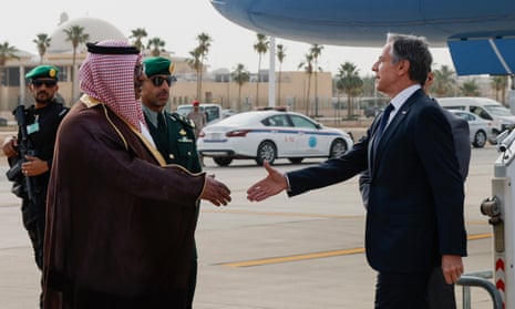 Antony Blinken about to shake hands with Saudi foreign ministry official Mohammed Al-Ghamdi as he arrives in Riyadh on Monday