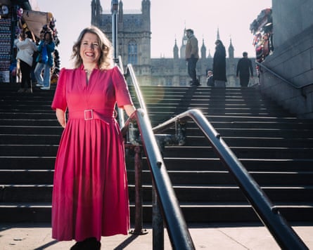Marie Tidball stands in front of steps in central London.