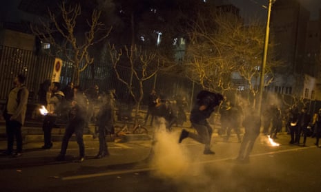 Iranians students protest in the street at night