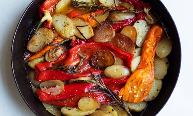 ‘Keep the ingredients partially covered as they cook so that they partly fry, partly steam’: sautéed peppers, potatoes.