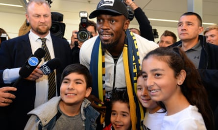 Usain Bolt poses with fans
