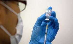 Medical staff prepares Moderna coronavirus vaccine to be administered at a mass vaccination centre in Tokyo, Japan.