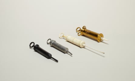Enema syringes made from ebony. ivory and metal