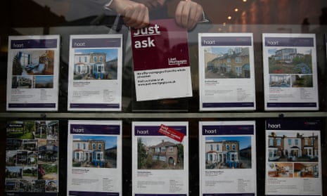 An estate agent’s window in London: mortgage approvals in March slumped by almost 21%