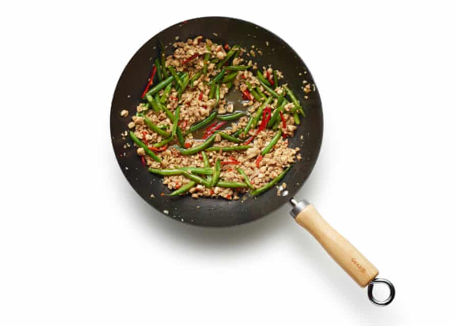 Felicity Cloake’s perfect pad kra pao, step 06: mix in veg, then basil leaves