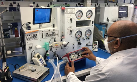 An employee tests a ParaPAC Plus ventilator