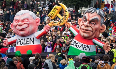 A satirical float features the Polish and Hungarian politicians Jarosław Kaczyński and Viktor Orbán during a parade in Dusseldorf, Germany