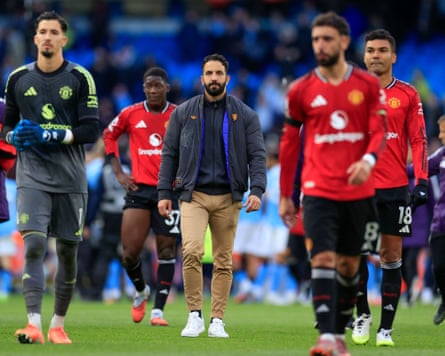 Ruben Amorim (centre) and his players trudge off the pitch
