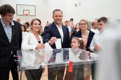 Karol Nawrocki, a non-partisan Presidential candidate supported by the right wing Law and Justice Party casts his ballot with his wife, Marta Nawrocka, and his family in Warsaw, Poland.