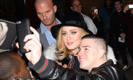The London-born singer with fans on a night out in New York on Friday.