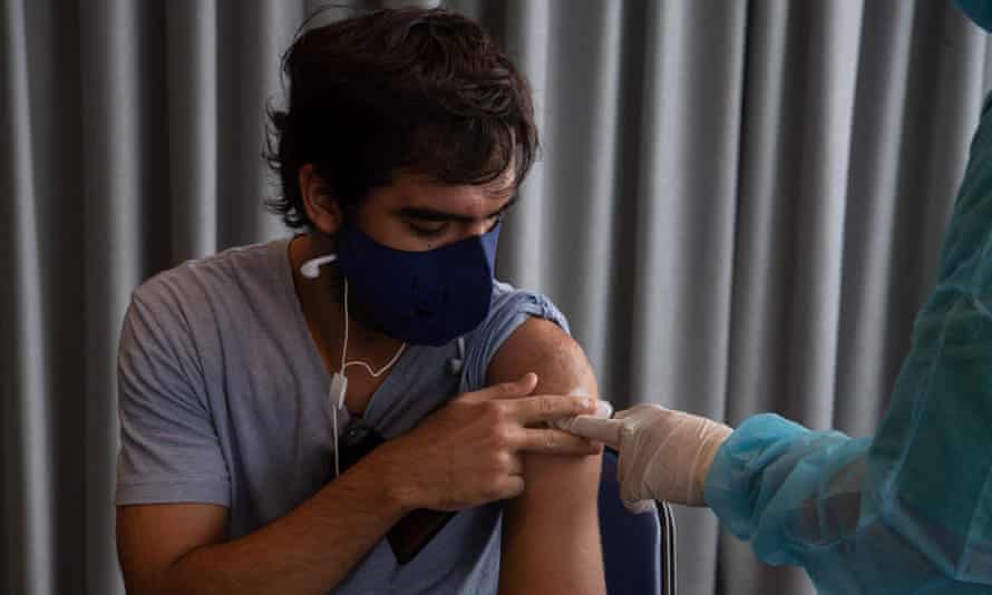 A man in the Uruguayan capital, Montevideo, gets a dose of the CoronaVac jab.