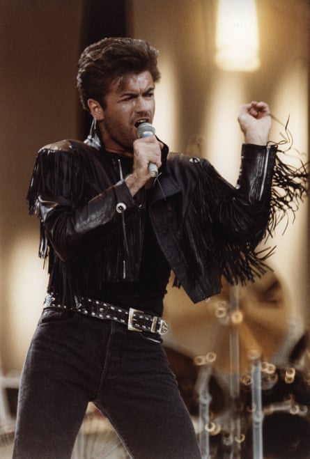 Michael performing at a Wham! farewell concert in 1986, in black leathers