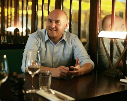 Will Beckett, the owner of Hawksmoor, seated with a glass of wine.