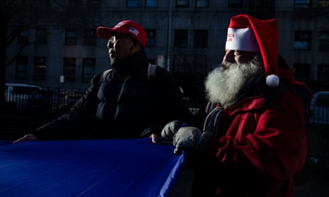Pro-Trump demonstrators help unfurl a large flag outside court ahead of Donald Trump’s sentencing in New York.