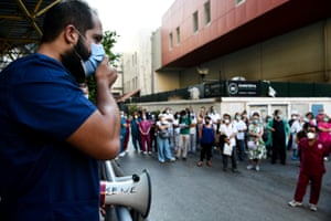 Heath workers protest outside a hospital against the government’s decision to make vaccination against Covid -19 mandatory for all health care workers in the public and private sector.