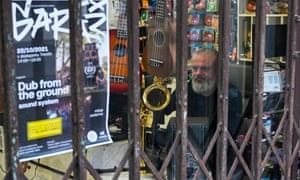 Roman Spatny inside his closed musical instrument store in Trenčín, Slovakia, today.