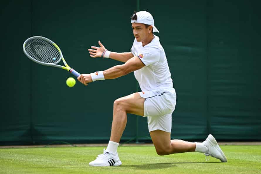 Ryan Peniston with a backhand return.