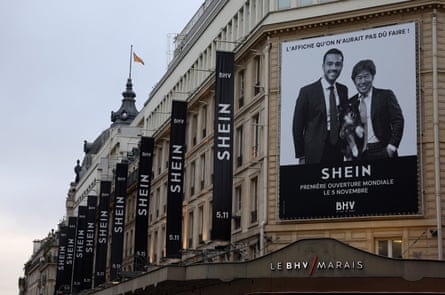 Shein banners on the side of the building, and an ad over the entrance