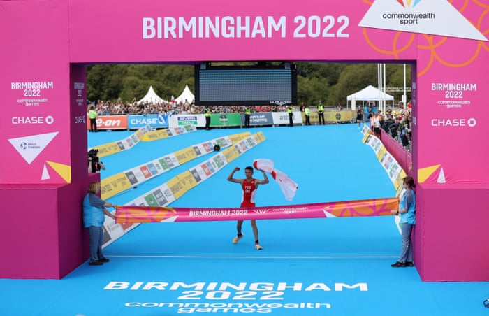 England’s Alex Yee celebrates before crossing the line to win the men’s individual sprint distance final.