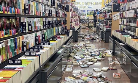 Books are scattered at a bookstore in Niigata, Japan following an earthquake Monday, Jan. 1, 2024. Japan issued tsunami alerts and told people to evacuate seaside areas after a series of strong quakes on its western coastline Monday.