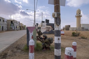 Israeli soldiers participate in a training session simulating urban warfare