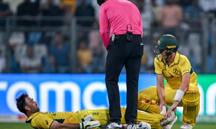Glenn Maxwell receives help from Pat Cummins