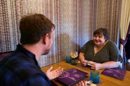 Keith and Amanda chatting across a restaurant table