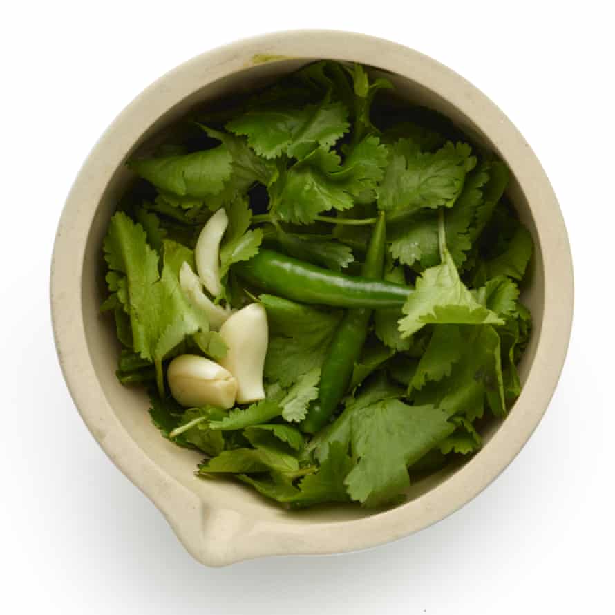 Felicity Cloake’s chana masala masterclass 3. While the onion is frying, put the garlic, ginger, chillies and a quarter of the coriander in a mortar and grind to a paste.