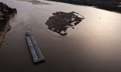 Barges loaded with cement navigate Paraguay river, in Asuncion amid a historic drought on 22 September.