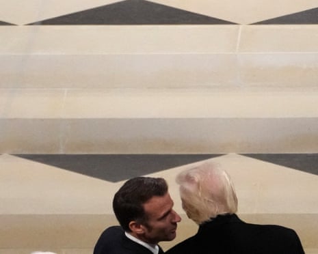French President Emmanuel Macron (L) talks with US President-elect Donald Trump (L) during a ceremony to mark the re-opening of the landmark Notre-Dame Cathedral in central Paris in 2024.