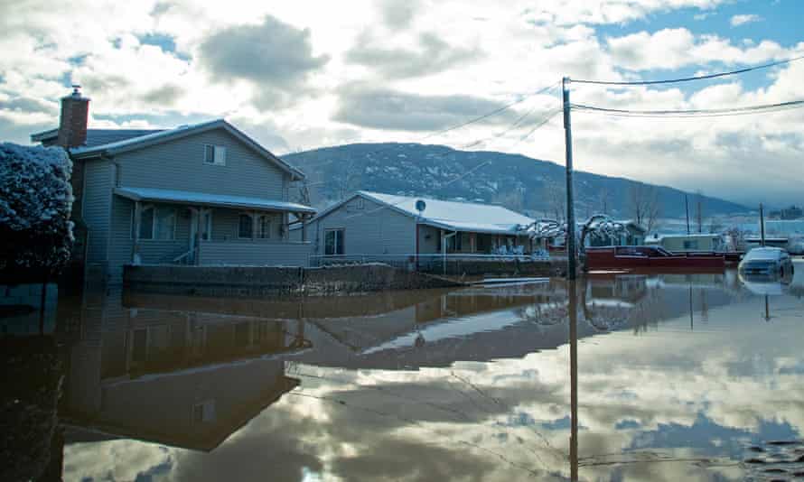 Flood waters cover a neighborhood a day after severe rain prompted the evacuation of the city of 7,000 in Merritt, British Columbia.