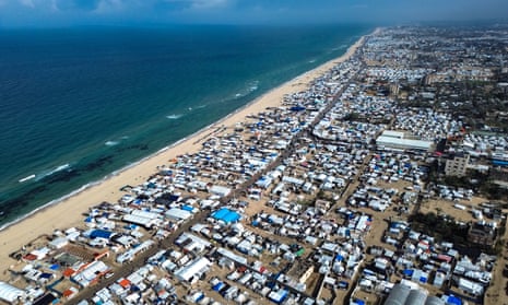 An encampment of tents for Palestinians displaced by the current conflict on the beach in Khan Younis.