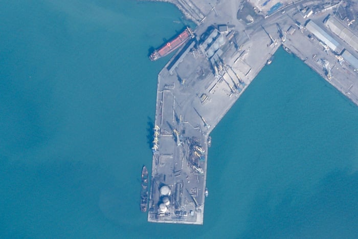 In this satellite photo from Planet Labs PBC, the partially sunken remains of a Russian landing ship are seen in the port city of Berdiansk, Ukraine.