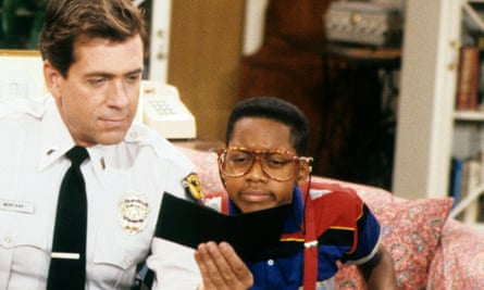 urkel looks at officer showing document