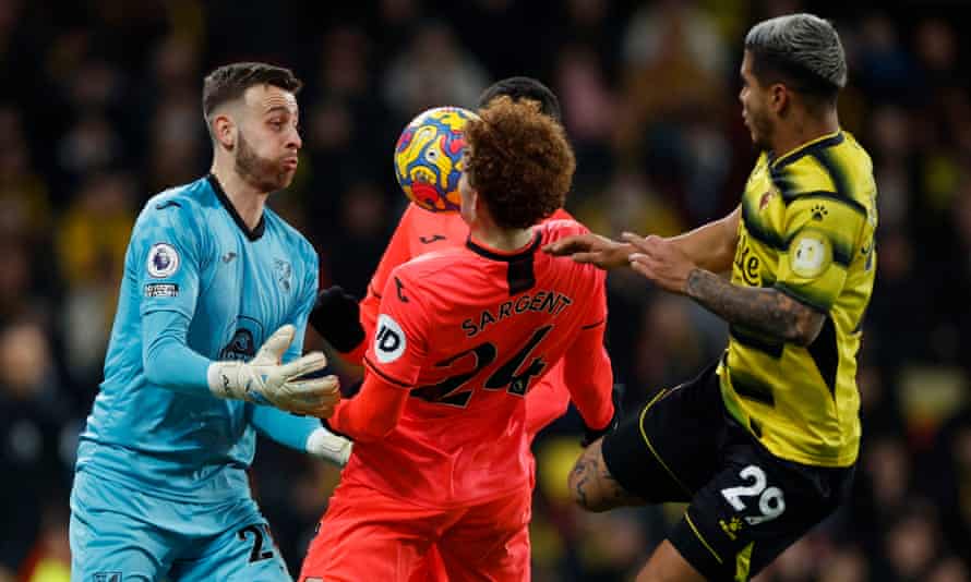 Norwich City’s Angus Gunn and Josh Sargent in action with Watford’s Cucho Hernandez.