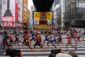 Runners pound the streets of Tokyo in the men’s marathon.