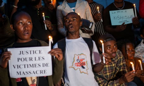 Congolese activists on a5 December at a vigil in memory of civilians killed in an earlier conflict between Armed Forces of the Democratic Republic of the Congo and rebel forces in Goma