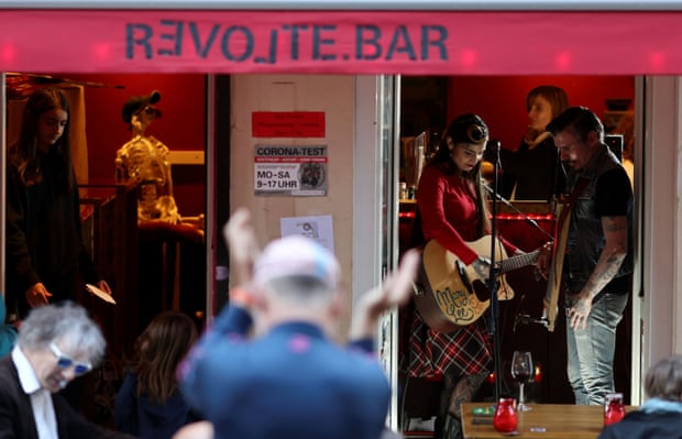 Artists perform at Revolte bar in Berlin, as cafes, bars and restaurants reopen their terraces after a Covid lockdown, May 2021